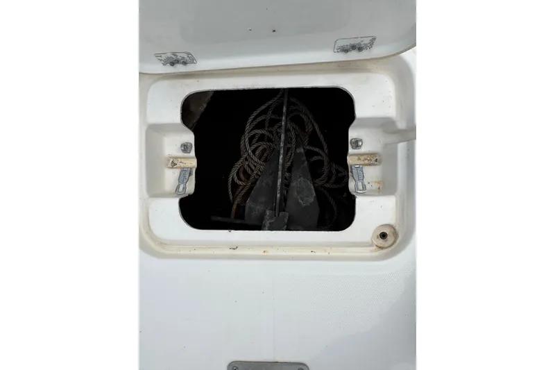 Slide: The Image of Anchor storage compartment on a 2010 Triton 240 LTS Pro boat. - 24