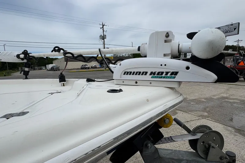 Slide: The Image of Minn Kota trolling motor on 2010 Triton 240 LTS Pro boat, parked outdoors. - 5