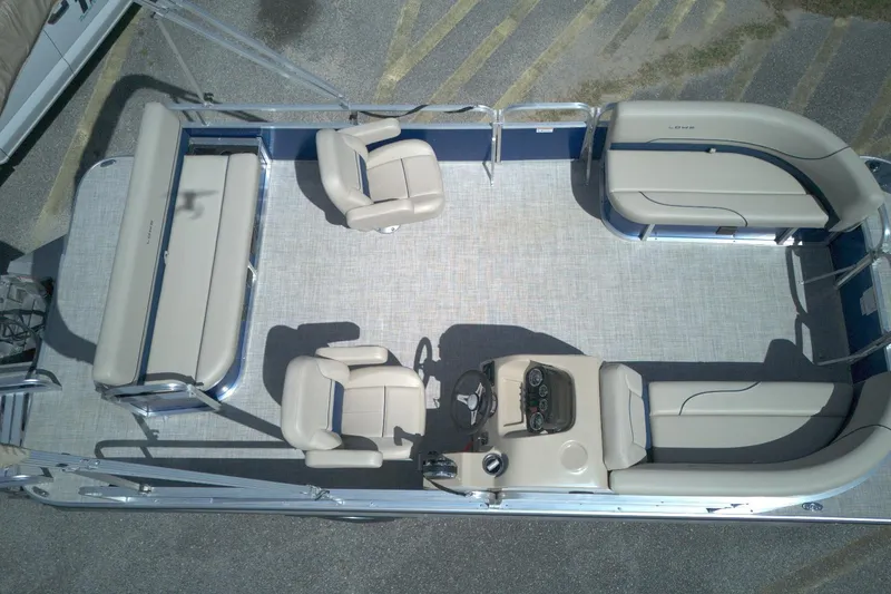 Slide: The Image of 2024 Lowe Ultra 200 Cruise pontoon boat interior with seating and helm, aerial view. - 13