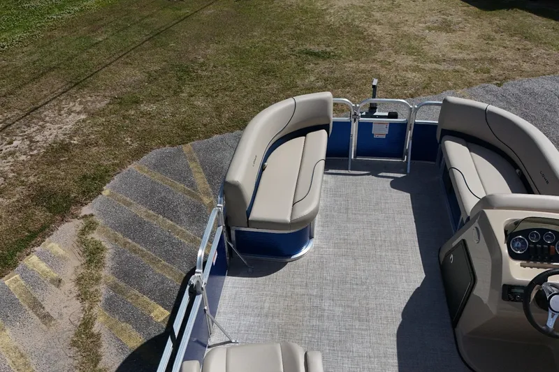 Slide: The Image of 2024 Lowe Ultra 200 Cruise pontoon boat with spacious seating and modern dashboard. - 5