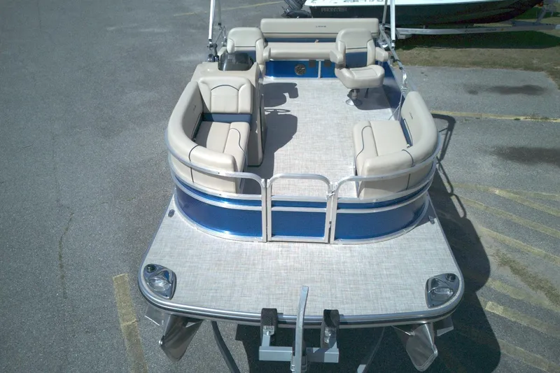 Slide: The Image of 2024 Lowe Ultra 200 Cruise pontoon boat with spacious seating and sleek design. - 9