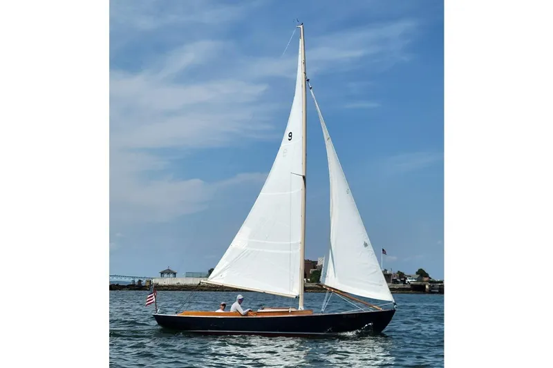 The Image of 1984 Hereshoff Alerion sailboat on calm waters under a clear blue sky. - 0