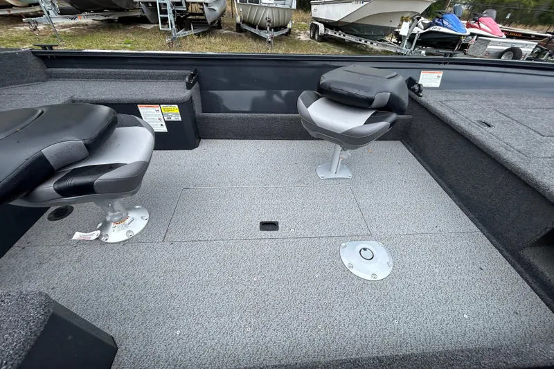 Slide: The Image of 2026 Crestliner 1650 Discovery Tiller boat interior with two swivel seats. - 13