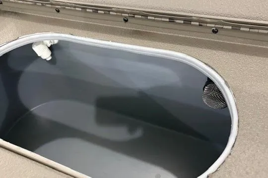 Slide: The Image of 2026 Xpress X18DB boat interior compartment with drainage and ventilation features. - 5