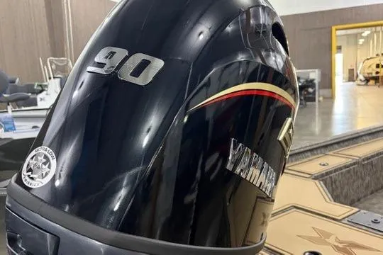 Slide: The Image of 2026 Xpress X18DB boat with Yamaha 90 outboard motor in a showroom. - 8