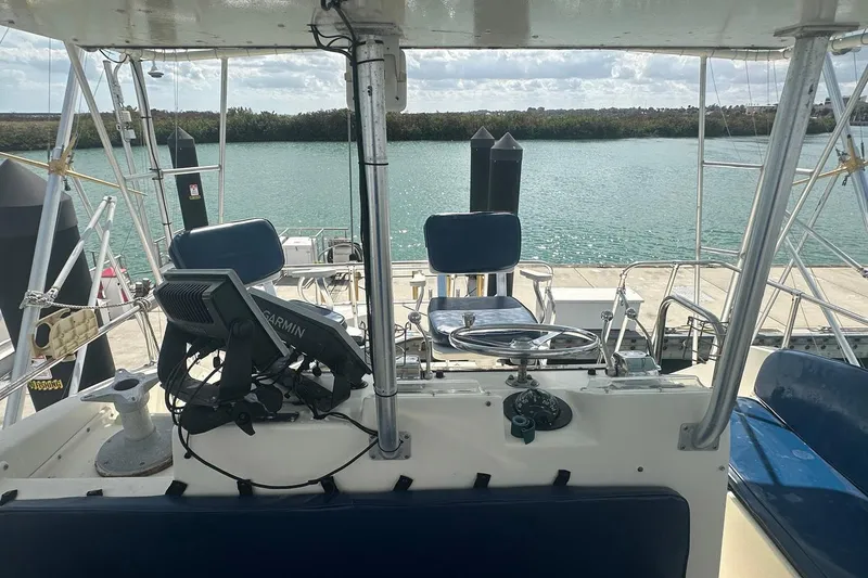 Slide: The Image of Cockpit view of 1981 Hatteras 43 Convertible yacht with Garmin navigation system. - 14