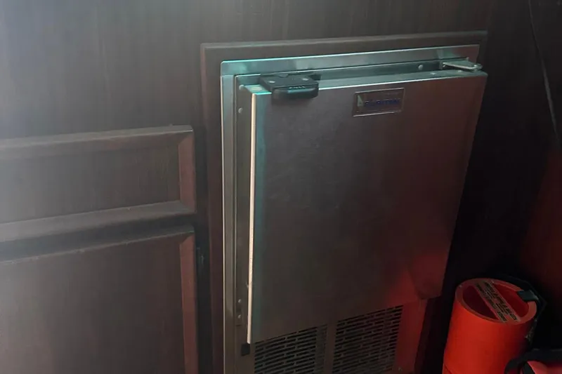 Slide: The Image of Stainless steel refrigerator on 1981 Hatteras 43 Convertible yacht interior. - 20