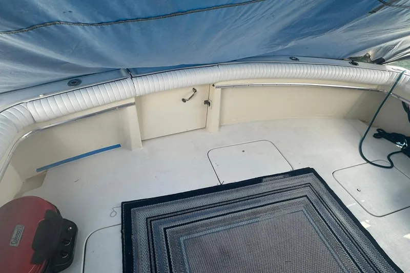 Slide: The Image of Interior view of a 1981 Hatteras 43 Convertible boat with seating and carpet. - 4