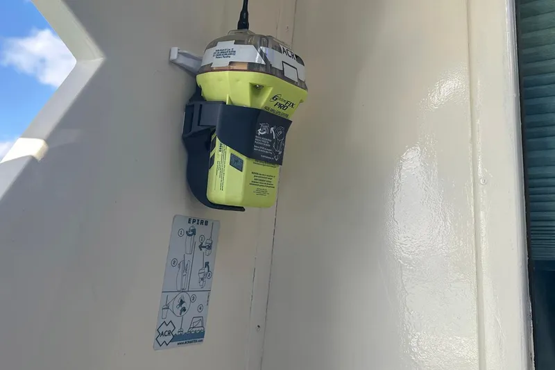 Slide: The Image of EPIRB mounted on 1981 Hatteras 43 Convertible boat, safety equipment visible. - 8