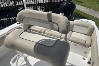 Slide: The Image of 2023 NauticStar 2302 Legacy boat interior with cushioned seating and sleek design. - 8