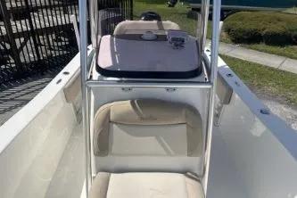 Slide: The Image of 2023 NauticStar 2302 Legacy boat interior with seating and console. - 9