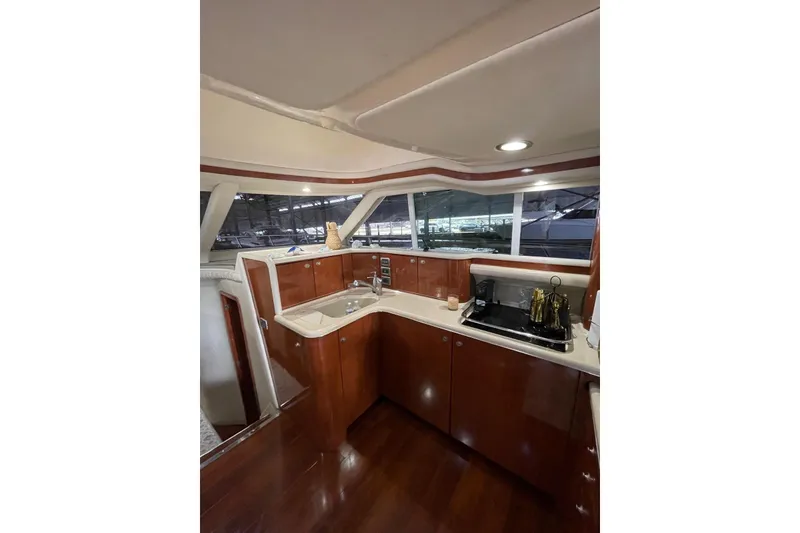 Slide: The Image of Luxurious kitchen interior of 2004 Sea Ray 480 Sedan Bridge yacht. - 13