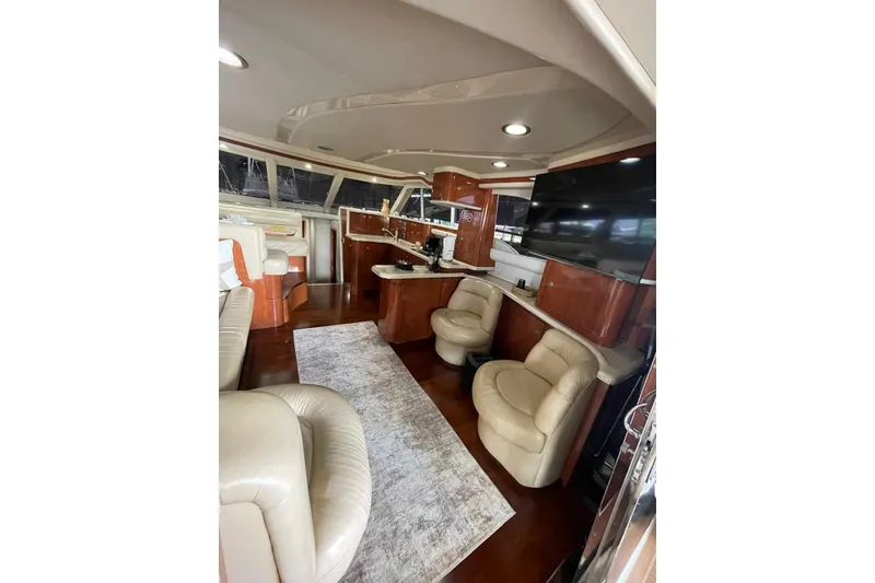 Slide: The Image of Luxurious interior of 2004 Sea Ray 480 Sedan Bridge yacht with leather seating and modern amenities. - 15
