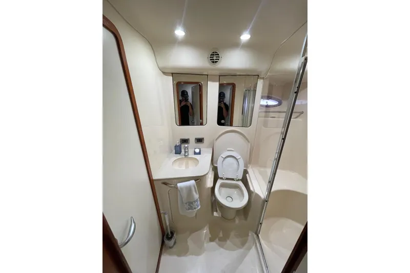Slide: The Image of Luxurious bathroom in 2004 Sea Ray 480 Sedan Bridge yacht, featuring modern fixtures and elegant design. - 6
