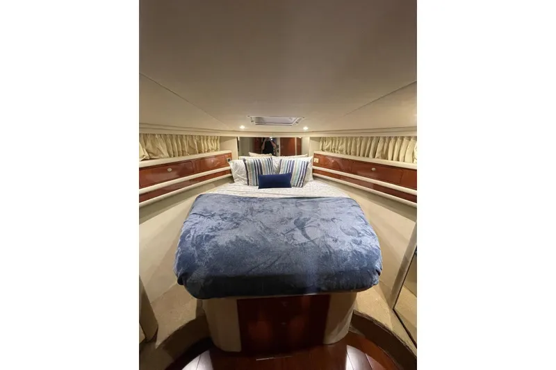 Slide: The Image of Luxurious cabin interior of 2004 Sea Ray 480 Sedan Bridge yacht with plush bedding. - 7
