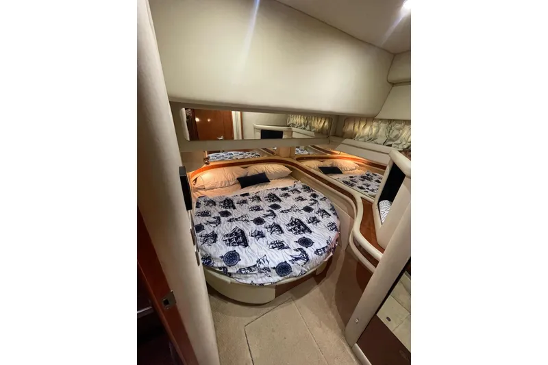 Slide: The Image of Luxurious bedroom interior of 2004 Sea Ray 480 Sedan Bridge yacht. - 8