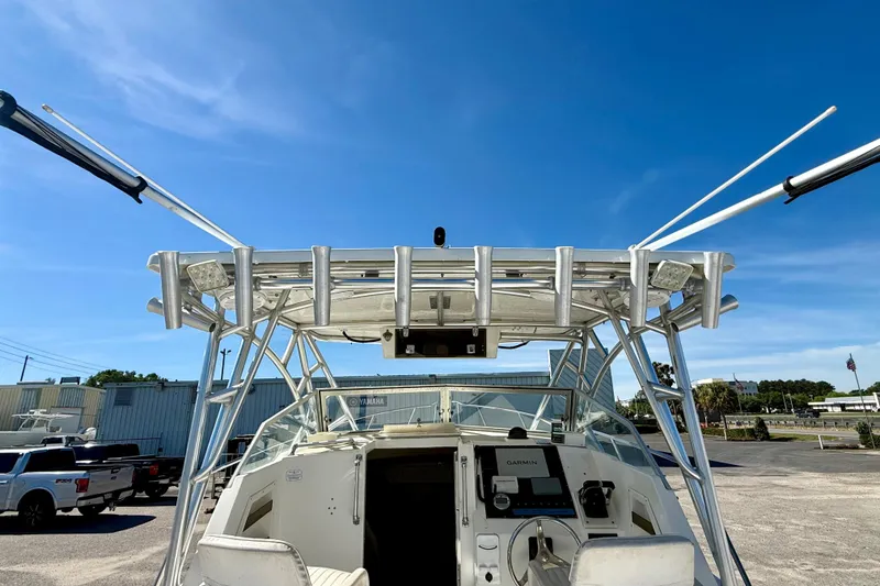 Slide: The Image of 1988 Negus 26 boat with aluminum T-top and clear blue sky background. - 9