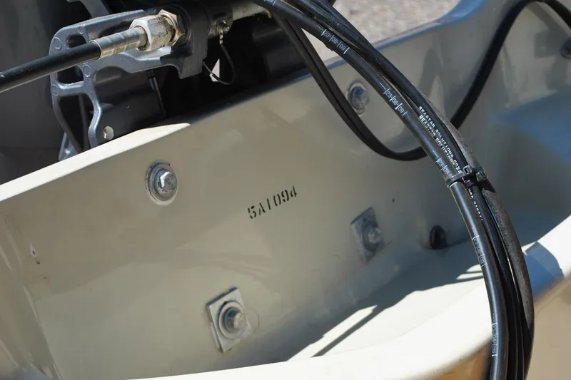 Slide: The Image of Close-up of a 1976 Boston Whaler 15 boat's interior, showing cables and hardware. - 8
