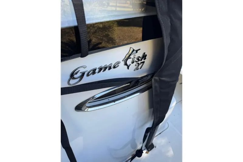 Slide: The Image of 2020 Sea Hunt Gamefish 27 Forward Seating boat emblem detail. - 13