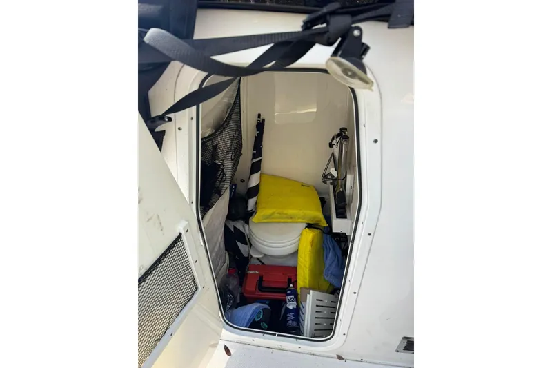 Slide: The Image of Interior storage of 2020 Sea Hunt Gamefish 27 boat with various equipment. - 15