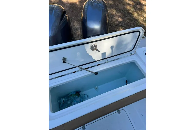 Slide: The Image of Open storage compartment on 2020 Sea Hunt Gamefish 27 boat, showing interior space. - 18