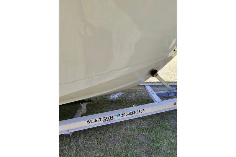Slide: The Image of 2020 Sea Hunt Gamefish 27 boat on Sea-Tech trailer, side view. - 2