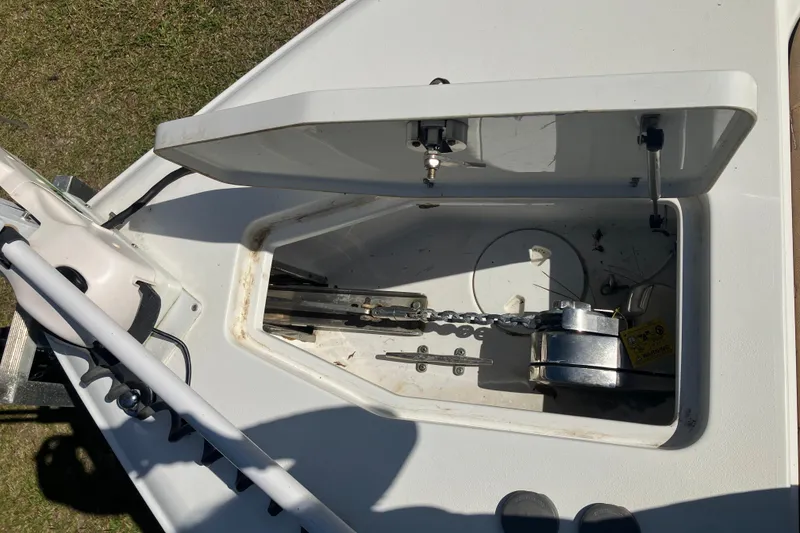 Slide: The Image of Open anchor compartment on 2020 Sea Hunt Gamefish 27 Forward Seating boat. - 30
