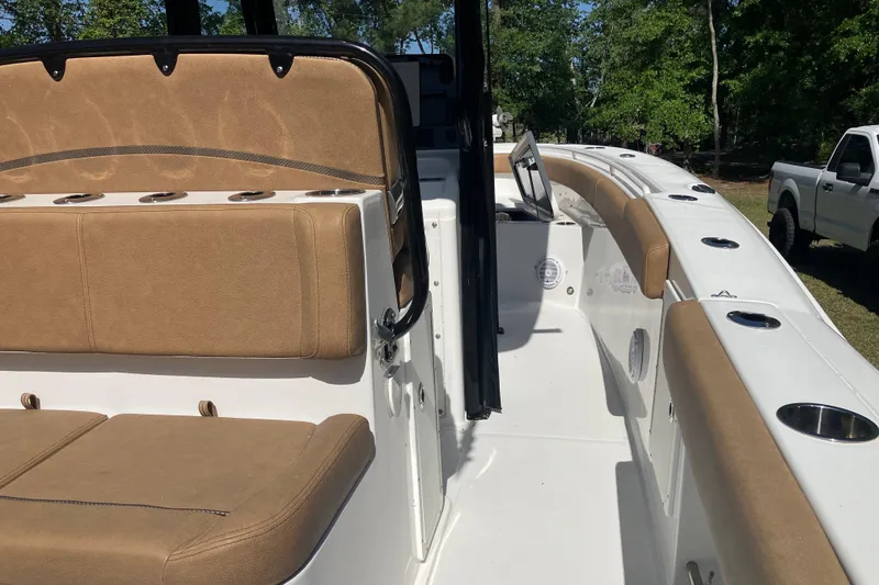 Slide: The Image of 2020 Sea Hunt Gamefish 27 boat with tan seating and spacious deck layout. - 38