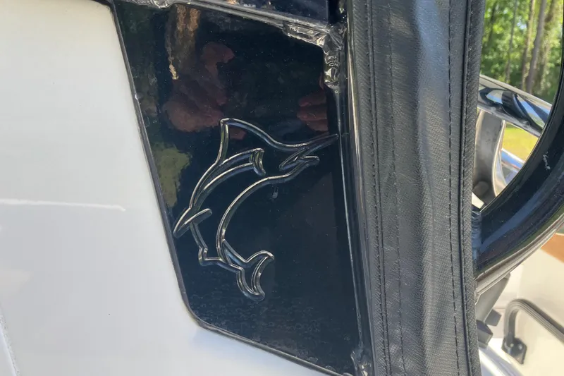 Slide: The Image of Embossed dolphin logo on 2020 Sea Hunt Gamefish 27 boat panel. - 40