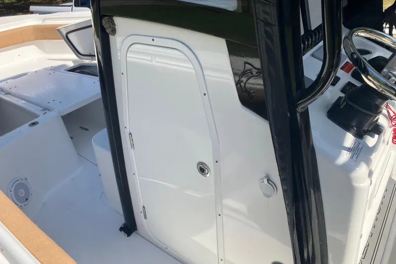 Slide: The Image of 2020 Sea Hunt Gamefish 27 Forward Seating boat interior with steering wheel and seating area. - 43