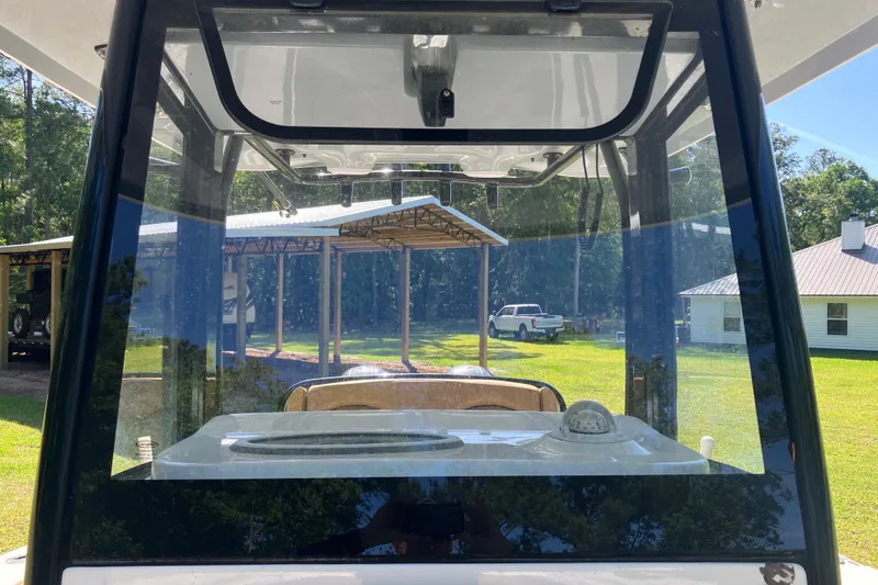 Slide: The Image of 2020 Sea Hunt Gamefish 27 Forward Seating boat interior view with clear windshield. - 46