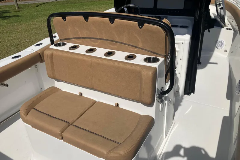 Slide: The Image of 2020 Sea Hunt Gamefish 27 boat seating with cup holders and tan upholstery. - 51