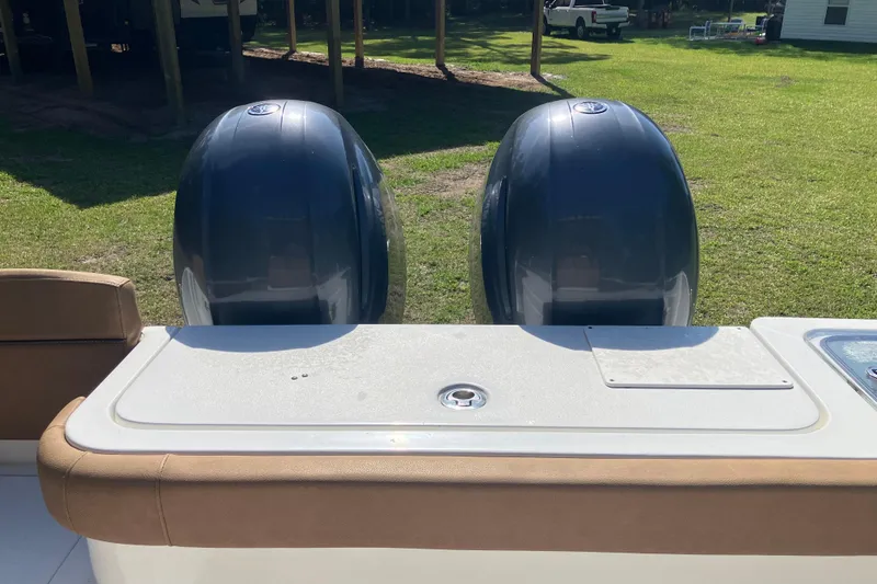 Slide: The Image of 2020 Sea Hunt Gamefish 27 boat with dual outboard motors, rear seating view. - 53