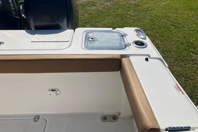 Slide: The Image of 2020 Sea Hunt Gamefish 27 boat interior with seating and storage compartments. - 55