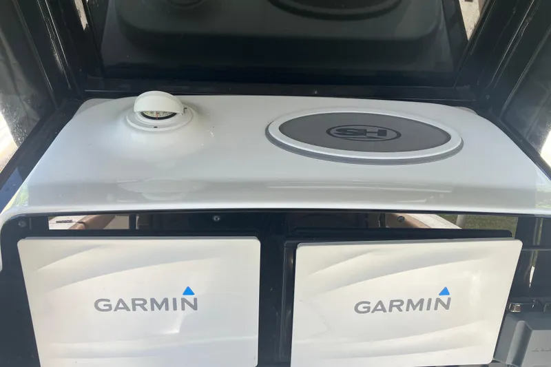 Slide: The Image of 2020 Sea Hunt Gamefish 27 dashboard with Garmin displays and compass. - 58