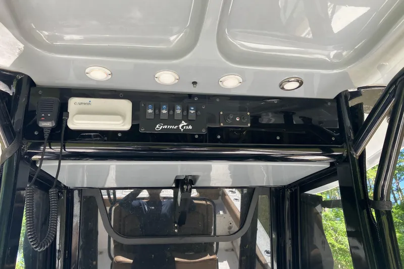 Slide: The Image of 2020 Sea Hunt Gamefish 27 dashboard with Garmin equipment and control panel. - 59