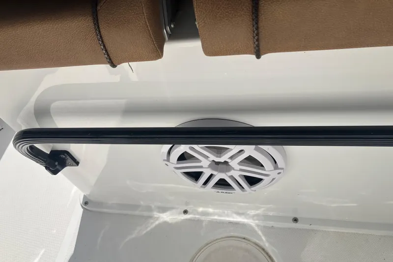 Slide: The Image of 2020 Sea Hunt Gamefish 27 interior with speaker and cushioned seating. - 62