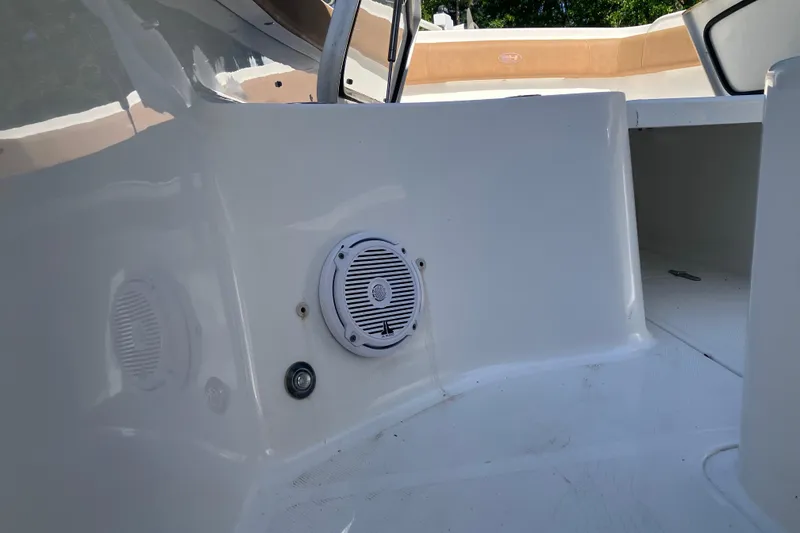 Slide: The Image of 2020 Sea Hunt Gamefish 27 boat interior with speaker and seating area. - 64