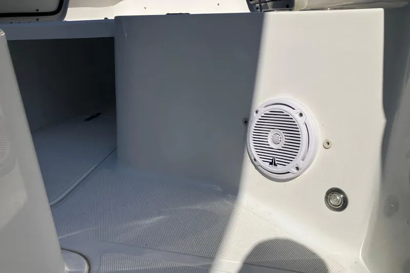 Slide: The Image of 2020 Sea Hunt Gamefish 27 boat interior with speaker and storage compartment. - 65