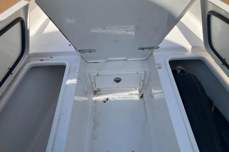 Slide: The Image of Open storage compartments on a 2020 Sea Hunt Gamefish 27 Forward Seating boat. - 67