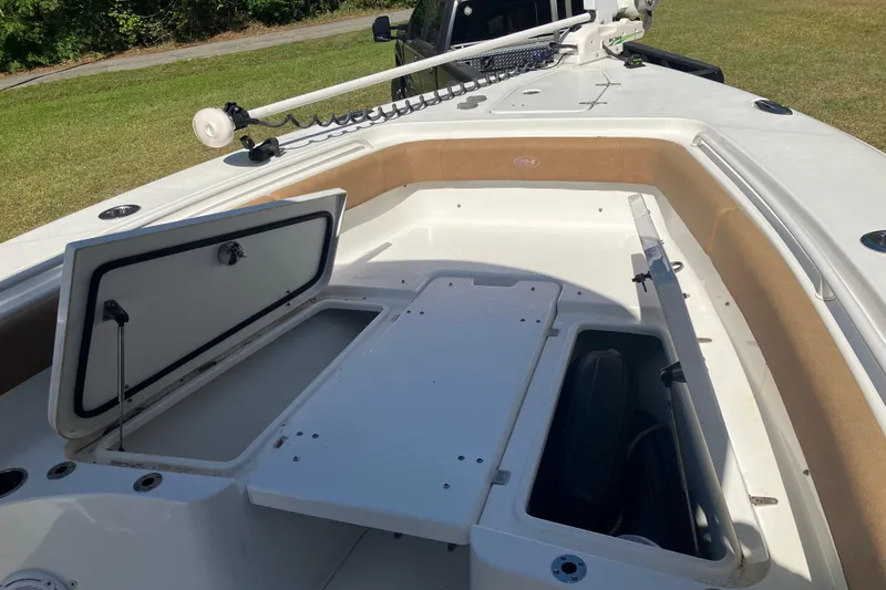 Slide: The Image of 2020 Sea Hunt Gamefish 27 Forward Seating boat with open storage compartments. - 68