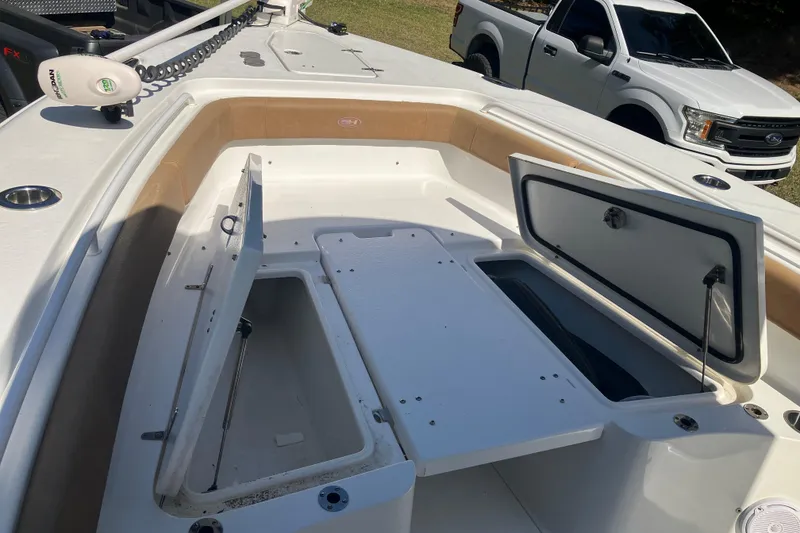 Slide: The Image of 2020 Sea Hunt Gamefish 27 Forward Seating boat with open storage compartments. - 69