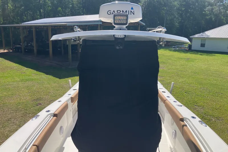 Slide: The Image of 2020 Sea Hunt Gamefish 27 boat with Garmin equipment, parked on grass. - 71
