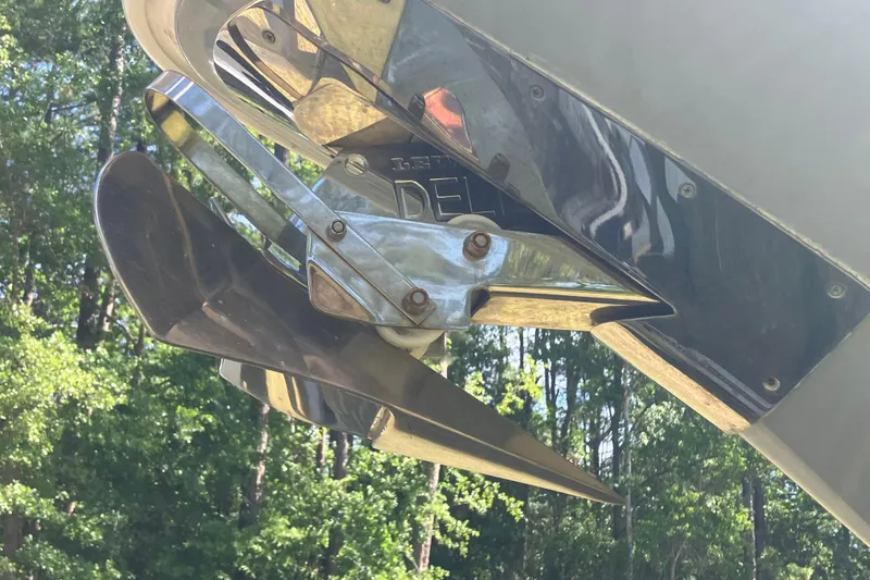 Slide: The Image of Close-up of a 2020 Sea Hunt Gamefish 27 propeller against a forest backdrop. - 80