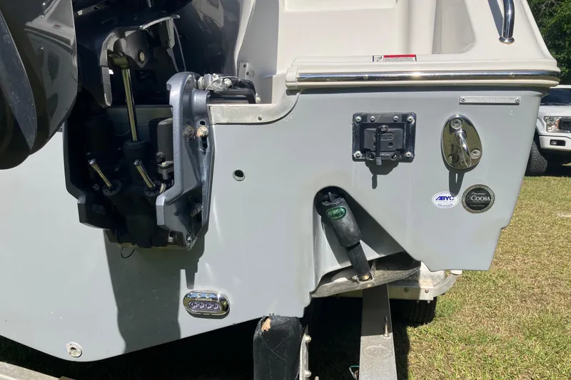 Slide: The Image of 2020 Sea Hunt Gamefish 27 boat stern with motor and hardware details. - 91