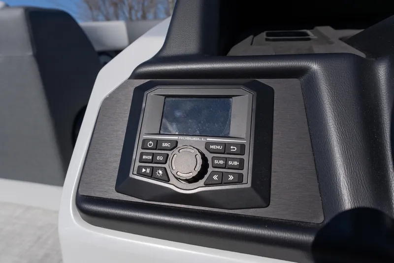 Slide: The Image of Control panel of 2026 Alera M23Q boat featuring a digital display and buttons. - 10