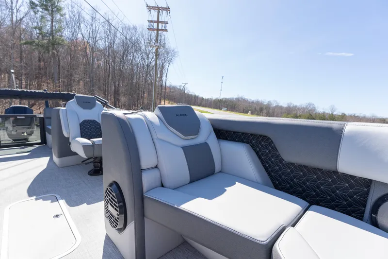 Slide: The Image of 2026 Alera M23Q boat interior with modern seating and scenic outdoor view. - 5