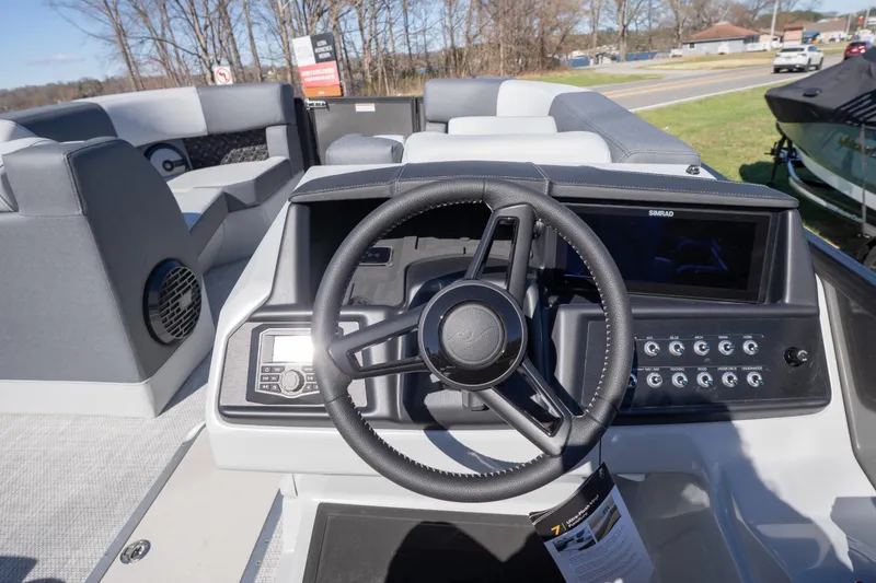 Slide: The Image of Interior view of 2026 Alera M23Q boat dashboard with steering wheel and control panel. - 8
