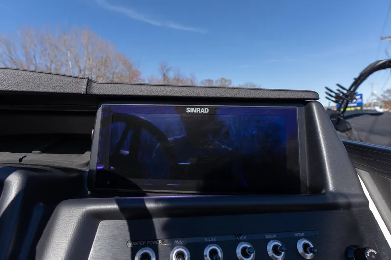 Slide: The Image of Simrad display on Alera M23Q 2026 dashboard under clear blue sky. - 9