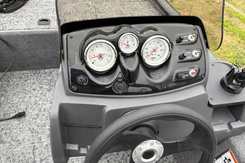 Slide: The Image of Dashboard of 2025 Tracker Pro 170 boat with gauges and controls. - 10
